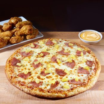 241 Pizza - a pizza with pineapple toppings and chicken wings - Pizza Near Me - Gananoque, Ontario