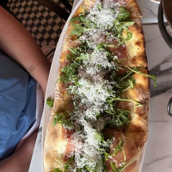 The Stinking Rose - Prosciutto San Daniele with Fontina, arugula and red pepper oil - Italian Near Me - San Francisco, California The Stinking Rose - Prosciutto San Daniele with Fontina, arugula and red pepper oil - Italian Near Me - San Francisco, California