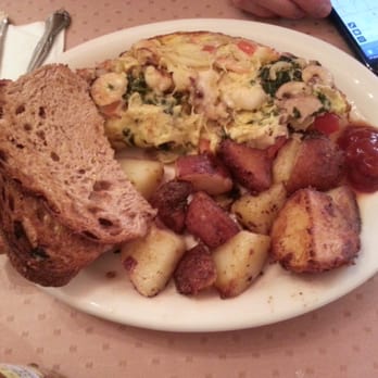 Katy's Place - Lance burrow omelette generously filled with seafood. Came with toast and house potatoes! - Breakfast & Brunch Near Me - Carmel, California Katy's Place - Lance burrow omelette generously filled with seafood. Came with toast and house potatoes! - Breakfast & Brunch Near Me - Carmel, California