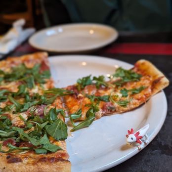 Alibi Room - a slice of pizza on a plate - New American Near Me - Seattle, Washington Alibi Room - a slice of pizza on a plate - New American Near Me - Seattle, Washington