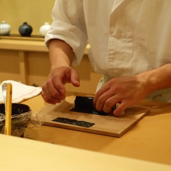 Kabuto - Step 3 to making a tuna scallion (negitoro) hand roll: roll and insert strip before completing the roll - Sushi Bars Near Me - Las Vegas, Nevada