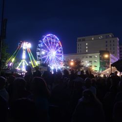 Skokie Backlot Bash - From the main stage audience, an evening view towards the rides.
