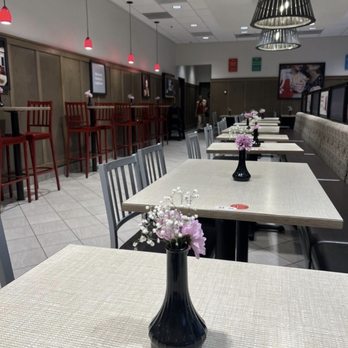 Chick-fil-A - Inside of the dining area with real flowers on the tables. - Chicken Shop Near Me - Monrovia, California Chick-fil-A - Inside of the dining area with real flowers on the tables. - Chicken Shop Near Me - Monrovia, California