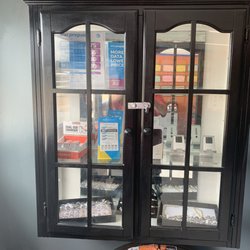 Cabinet with cell phones and rings we offer at a very reasonable rate