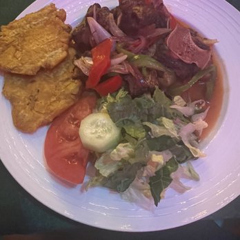 Berny’s Kitchen & Bar - Oxtail with plantain and side salad - Haitian Near Me - Pembroke Park, Florida