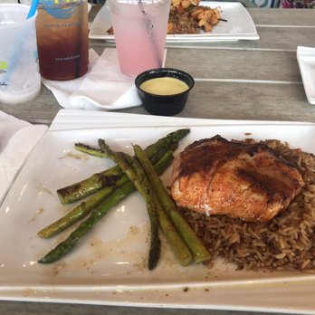 RipTydz - Bacon wrapped halibut over rice with aspy - Seafood Near Me - Myrtle Beach, South Carolina RipTydz - Bacon wrapped halibut over rice with aspy - Seafood Near Me - Myrtle Beach, South Carolina
