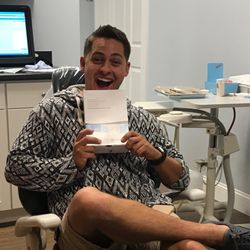 Heritage Dental Spa & Salon - Happy Invisalign patient.