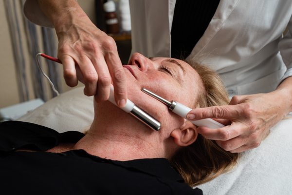 Facials - We offer a variety of different facials to suit your skin. You'll instantly notice the difference in the overall tone & texture of your skin. Includes steam therapy, double cleansing, extractions, relaxing massage of the face, neck, décolletage, and shoulders, finished out with a customized mask. Facials - We offer a variety of different facials to suit your skin. You'll instantly notice the difference in the overall tone & texture of your skin. Includes steam therapy, double cleansing, extractions, relaxing massage of the face, neck, décolletage, and shoulders, finished out with a customized mask.