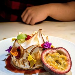 Glass Kitchen - Baked Alaska 5*: squeeze the passionfruit over it before cutting it open