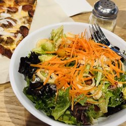 Freda's Pizza Kitchen - My quick lunch today! I treat myself every Friday. Mixed green salad, A slice of delicious pizza.