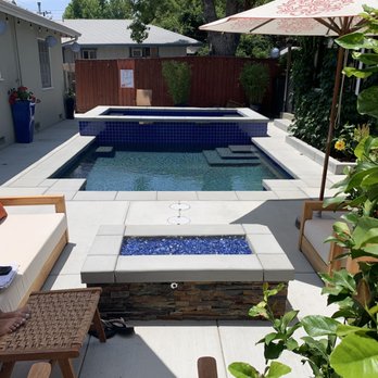 Swan Pools - Our fire pit is amazing at night! - Pool & Hot Tub Service Near Me Swan Pools - Our fire pit is amazing at night! - Pool & Hot Tub Service Near Me