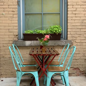 Juice By J - a table and chairs outside a window - Vegan Near Me - Grand Rapids, Michigan Juice By J - a table and chairs outside a window - Vegan Near Me - Grand Rapids, Michigan