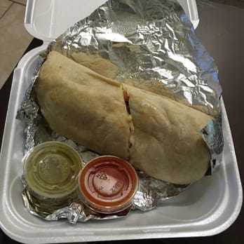 Mi Carnal Restaurant - Biggest burrito with steak and chicken and homemade hot pepper sauces - Mexican Near Me - Saint Augustine, Florida