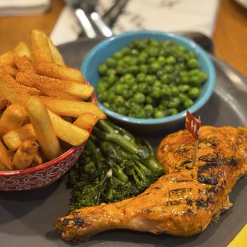 Nando's - 1/4 chicken mean with an extra side of chips - Chicken Shop Near Me - Kensington, XGL
