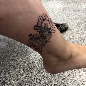 Fine Tattoo Work - Sunflowers added to my friends horseshoes. All done by Ramon. - Tattoo Near Me - Orange, California Fine Tattoo Work - Sunflowers added to my friends horseshoes. All done by Ramon. - Tattoo Near Me - Orange, California