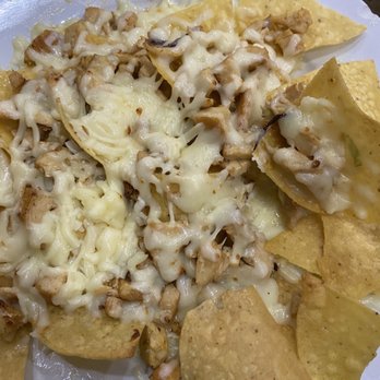 Carreta's Grill - Grilled chicken nachos with toppings on side - Mexican Near Me - Metairie, Louisiana