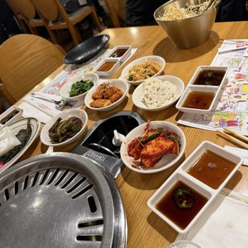 Yellow Cow Korean BBQ Restaurant - All the goddies that come the the different rare meat that you cook in the fire in your table... - Korean Near Me - Gardena, California