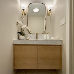 LA Marble And Granite - Carrara marble countertop in the powder room.