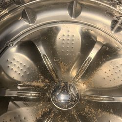 LH Brubaker Appliances & Water Treatment - Brown flakes in washing machine.