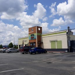 a parking lot with a clock tower