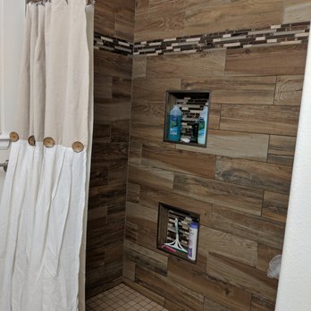 All About Bathrooms - a shower with a shower curtain - General Contractors Near Me - Aurora, Colorado