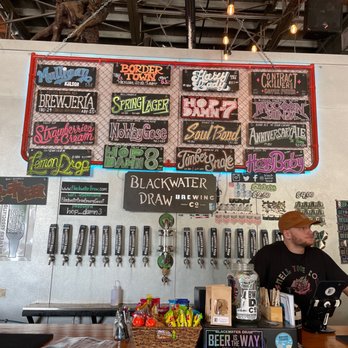 Blackwater Draw Brewing - a man behind the bar - Breweries Near Me - Bryan, Texas
