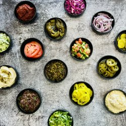 Mesubbim Express - Our assortment of veggies and toppings, both Mediterranean and American flavors, to create your own masterpiece just he way you like it!