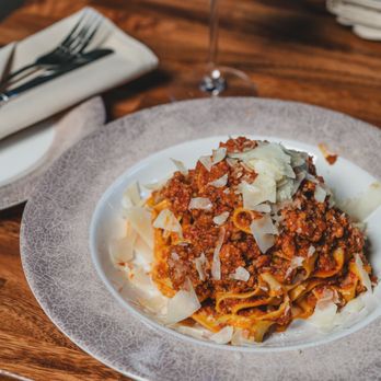 Corrado's Cucina - a plate of pasta and a glass of wine - Italian Near Me - Staten Island, New York