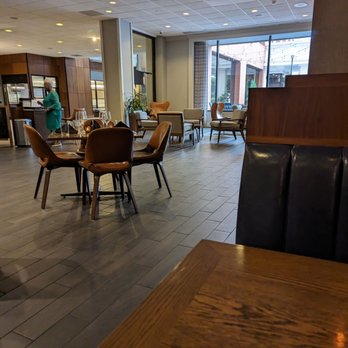 Butcher & Bull - a restaurant with tables and chairs - Steakhouses Near Me - Winston-Salem, North Carolina