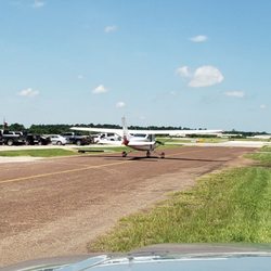 Gill Aviation David Wayne Hooks Airport - Not every day you get to drive down the road behind a plane, unless you're at the airport.