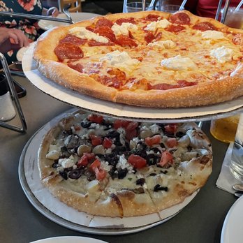 Dewey's Pizza - two pizzas on a table - Pizza Near Me - Dublin, Ohio