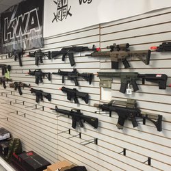 Airsoft Barracks - Huge wall of guns for sale, both used and new.