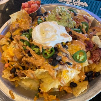 Sidecar Social - These are wonton nachos and I can't stress enough that every place should have nachos with these type of chips! These. Are. Insane!!! - Sports Bars Near Me - Addison, Texas Sidecar Social - These are wonton nachos and I can't stress enough that every place should have nachos with these type of chips! These. Are. Insane!!! - Sports Bars Near Me - Addison, Texas