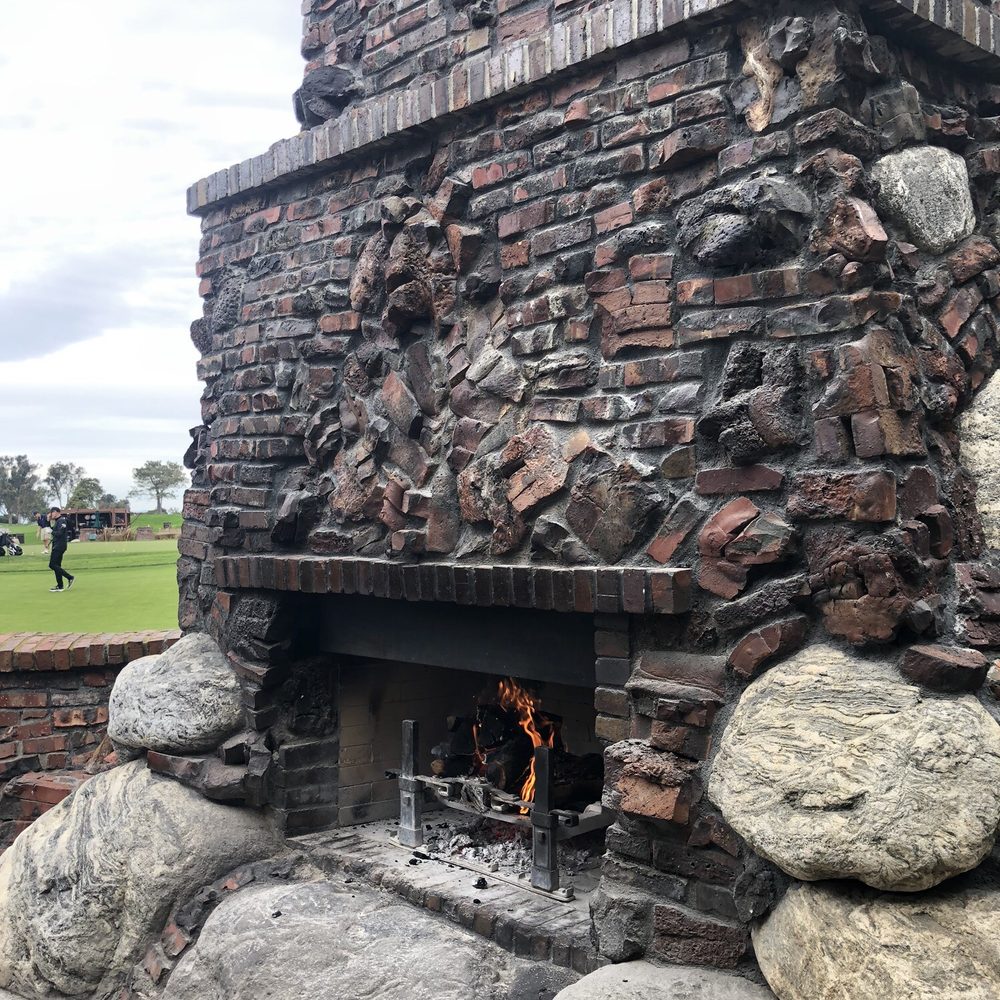 The Grill At Torrey Pines - Stone hearth fireplace outside patio - New American Near Me - La Jolla, California The Grill At Torrey Pines - Stone hearth fireplace outside patio - New American Near Me - La Jolla, California
