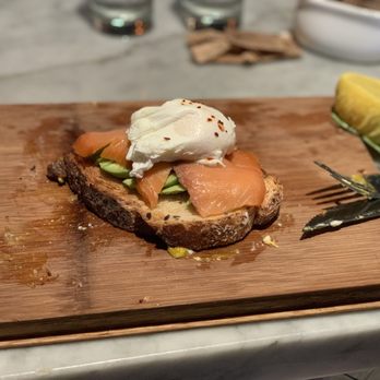 Orange Blossom - Avocado toast with poached eggs and smoked salmon - Breakfast & Brunch Near Me - Miami Beach, Florida Orange Blossom - Avocado toast with poached eggs and smoked salmon - Breakfast & Brunch Near Me - Miami Beach, Florida