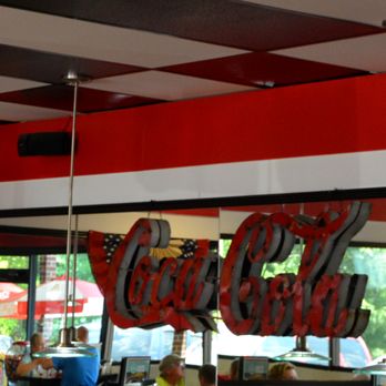Park Road Soda Shoppe - Kannapolis - Coke logo on mirrored wall in dining room - American Near Me - Kannapolis, North Carolina Park Road Soda Shoppe - Kannapolis - Coke logo on mirrored wall in dining room - American Near Me - Kannapolis, North Carolina