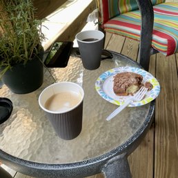 Vanilla latte, black coffee and yummy coffee cake, on precious back porch.