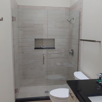 ABA Remodeling - a bathroom with a skylight - Painters Near Me