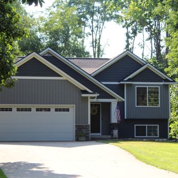 Green Built Roofing - Timberline HDZ Charcoal Roof, Midnight Blue Siding, White Restoration Mill Work & Seamless Rain Gutters. - Roofing Near Me - Byron Center, Michigan