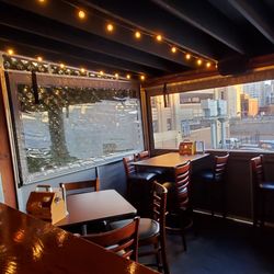 Harry's Detroit Bar & Grill - View upstairs at Harry's Detroit Bar & Grill.  Zip windows and small parking lot downstairs offers heated tents and high tops.  11/30/2023