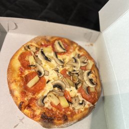 Mini size pizza with pepperoni, mushroom, and pineapple Mini size pizza with pepperoni, mushroom, and pineapple