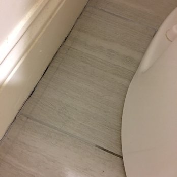 Salem Inn - Bathroom floor near the commode - Hotels Near Me - Salem, Massachusetts