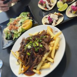 Elk poutine, elk tacos, caesar side salad Elk poutine, elk tacos, caesar side salad