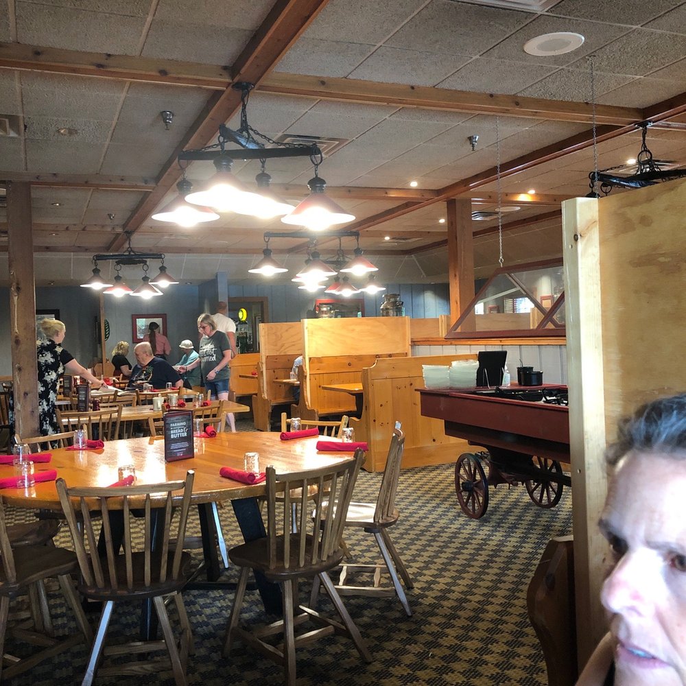 Machine Shed Restaurant - a woman sitting at a table - American Near Me - Appleton, Wisconsin Machine Shed Restaurant - a woman sitting at a table - American Near Me - Appleton, Wisconsin