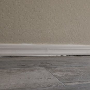 Kodiak Tile and Stone - Damage to baseboards - Flooring Near Me