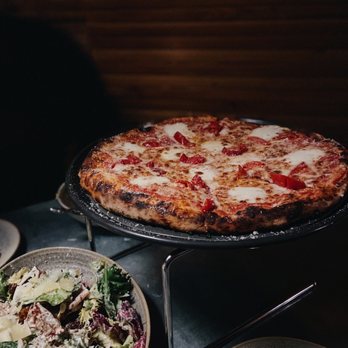 Sunny Hill - Tasty pizza and Caesar salad at Sunny Hill in Sunset Hill. - Pizza Near Me - Seattle, Washington