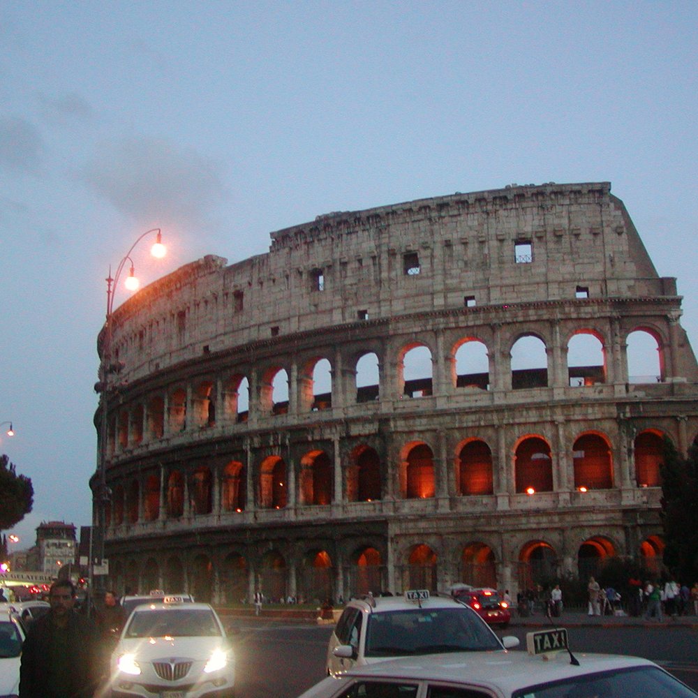 Colosseo - The Colosseum and some cars coming to run me over. - Local Flavor Near Me - Rome, RM