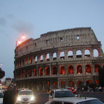 Colosseo - The Colosseum and some cars coming to run me over. - Local Flavor Near Me - Rome, RM