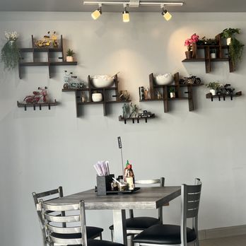 iPho - a table and chairs in a restaurant - Vietnamese Near Me - Killeen, Texas