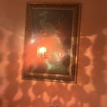 Anarbagh - a vase of flowers in front of a painting - Indian Near Me - Encino, California Anarbagh - a vase of flowers in front of a painting - Indian Near Me - Encino, California